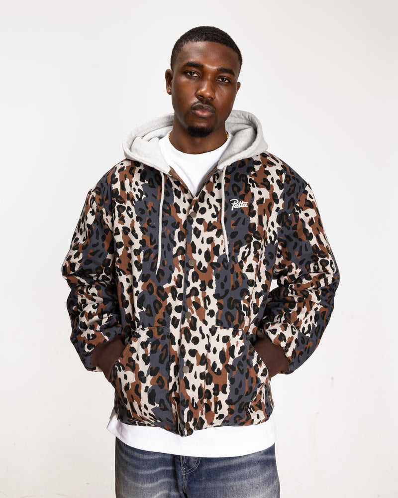 close up model shot of the leopard side of the reversible leopard bomber jacket showing the leopard allover print and a patta script logo